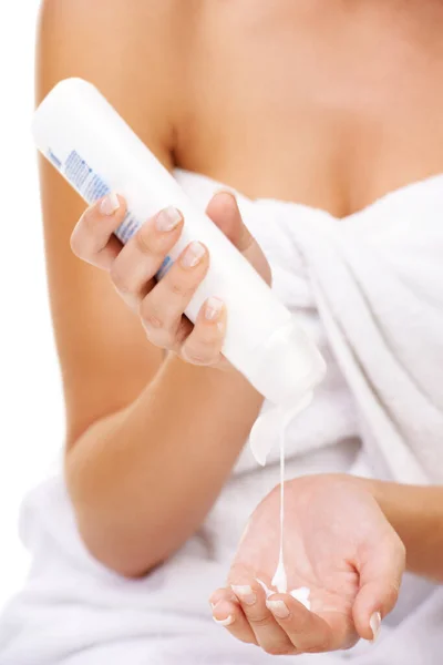 Adding Some Moisture Young Woman Squeezing Body Lotion Her Hand — Stock Photo, Image