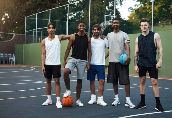 Its not how big you are, its how big you play. Portrait of a group of sporty young men hanging out on a basketball court