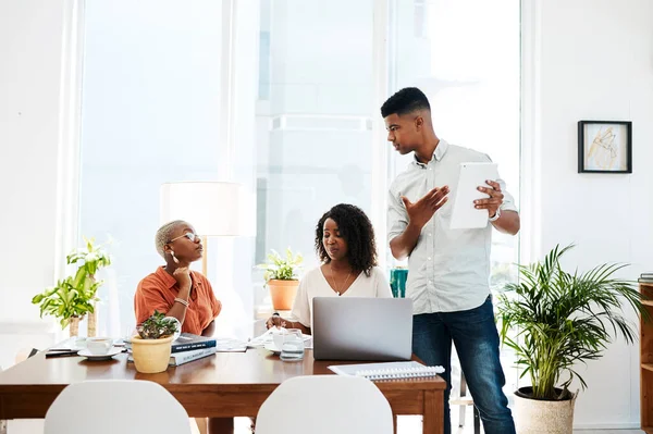 stock image Discussing their next big proposal. a group of businesspeople having a discussion in an office