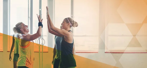 Fitness group, gym and high five for exercise, workout and training mockup space. Diversity sports women together to celebrate win, overlay and strong muscle motivation at health and wellness club.