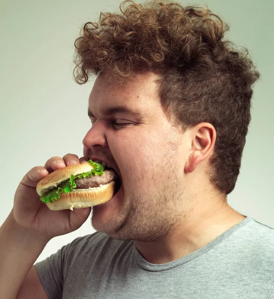 Enjoying Tasty Burger Closeup Shot Man Biting Burger — Stock Photo, Image