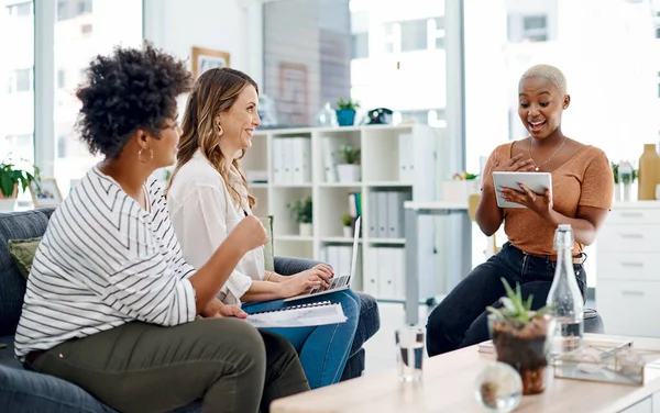 stock image Their talents combined bring out the best results. a group of businesswomen having a discussion in an office