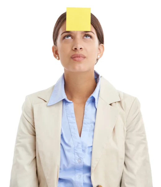 stock image For those forgetful moments. Studio shot of an attractive young businesswoman with a sticky note stuck to her forehead