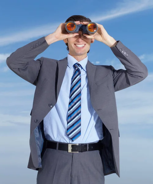 Binoculars, opportunity and search for business man with blue sky, smile and investigation. Executive, job and searching for outdoor businessman with investigate gear and future vision ready for work.
