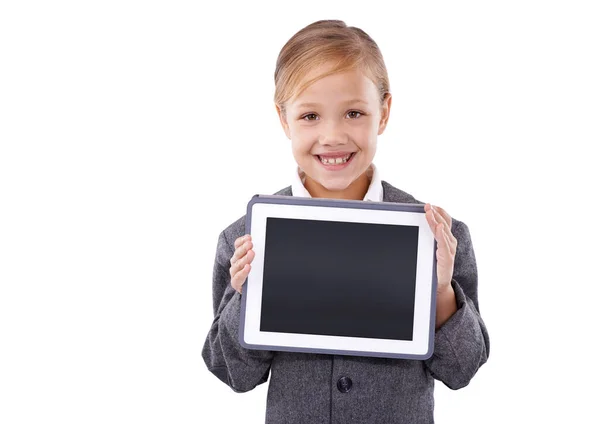 stock image Arent you impressed. Cute young girl holding a tablet and smiling on isolated background