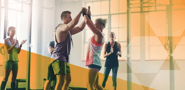 stock image Fitness, group and high five to celebrate success for exercise, workout or training goal or win. Men and women happy applause for sport challenge, motivation or achievement at gym with mockup overlay.