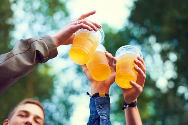 stock image Heres to us. a group of friends toasting with beers