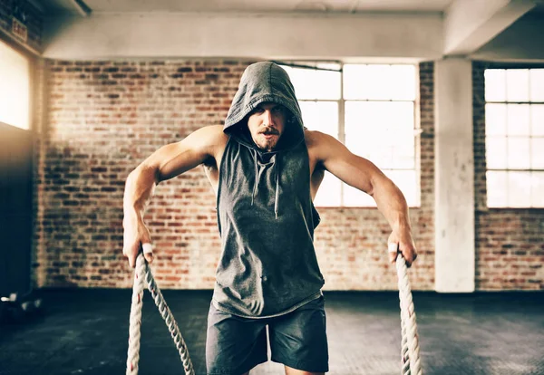 Rope Training Hooded Determined Young Man Making Use Ropes Workout — Stock Photo, Image