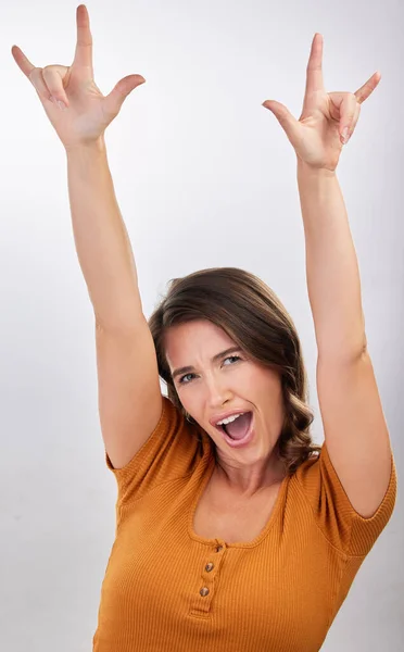 Rocking Rolling Studio Shot Young Woman Showing Rock Sign Her — Stock Photo, Image