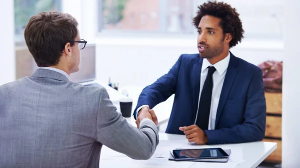 stock image Getting down to business. businessmen shaking hands in an office