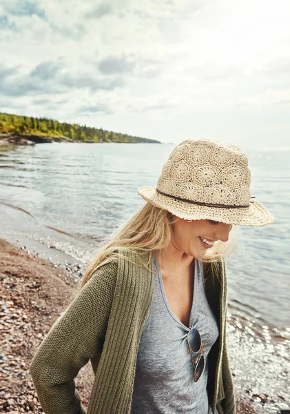 stock image On that relaxation buzz. a young woman spending a day at the lake