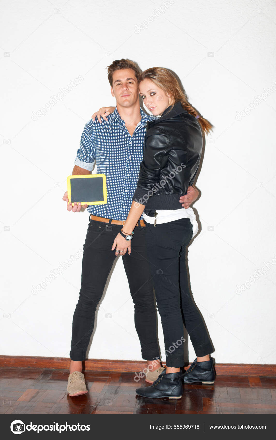 Portrait of a smiling multiethnic couple standing isolated over yellow  background, covering eyes of his girlfriend Stock Photo - Alamy