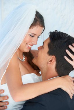 Youre the life of my life. A groom lifting his gorgeous bride into the air and smiling at her clipart