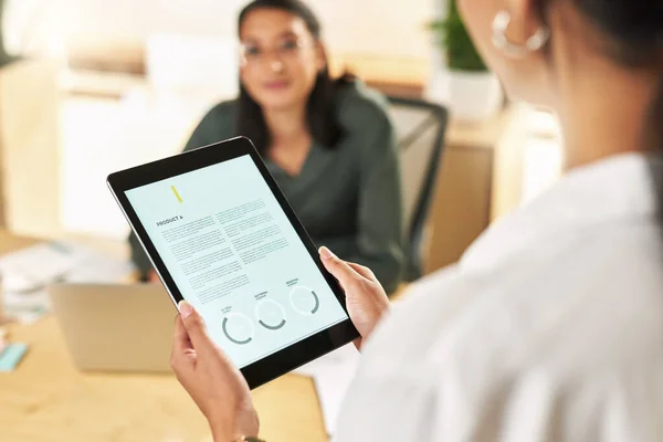 stock image Will you give me your feedback. two businesswomen using a digital tablet to oversee work