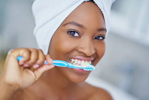 stock image Teeth need tlc too. a beautiful young woman during her daily beauty routine