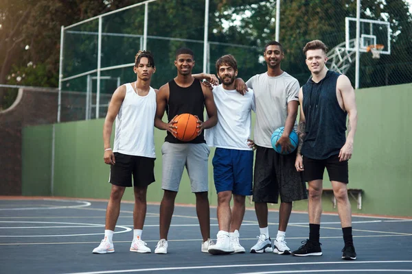 We practice winning every day. Portrait of a group of sporty young men hanging out on a basketball court
