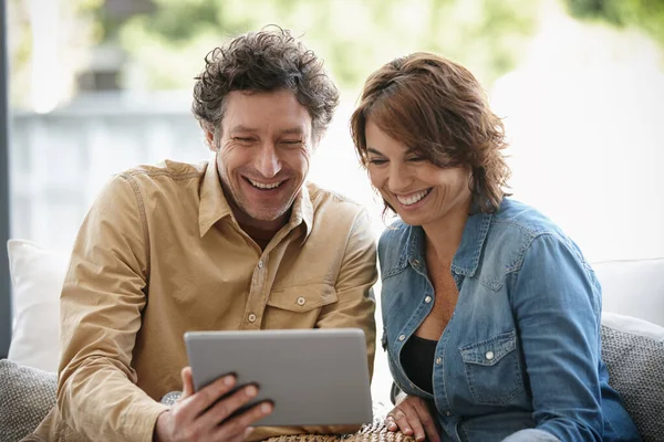 stock image Home living online. a husband and wife using a digital tablet together at home