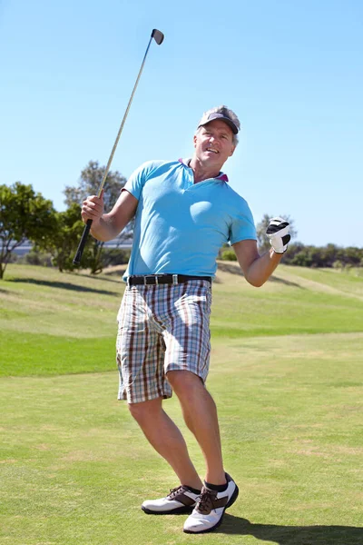 Happy golfer man, fist celebration and game on grass with winning, goal or outdoor for sports, exercise or contest. Senior guy, winner and excited at golf course with sunshine, competition or workout.