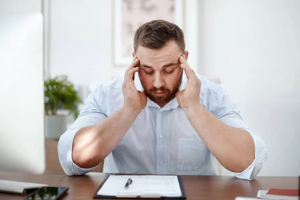 Documents, headache and business man in office with career burnout, mental health risk and paperwork. Brain fog, problem or pain of tired person or employee with fatigue and stress for writing notes.