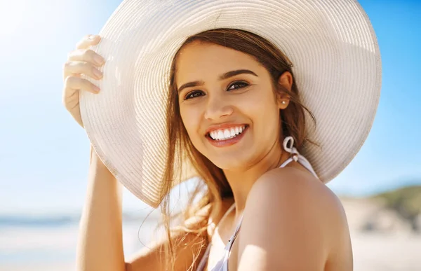 stock image You just cant say summer with a frown. Closeup shot of a beautiful young woman spending some time at the beach