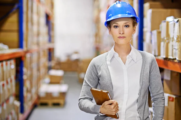 I guarantee your order on time. a woman at work in a storage warehouse