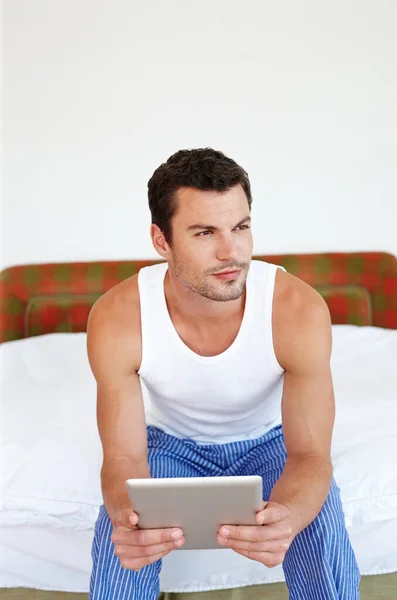 Always Connected Man Sitting His Bed Holding Digital Tablet — Stock Photo, Image