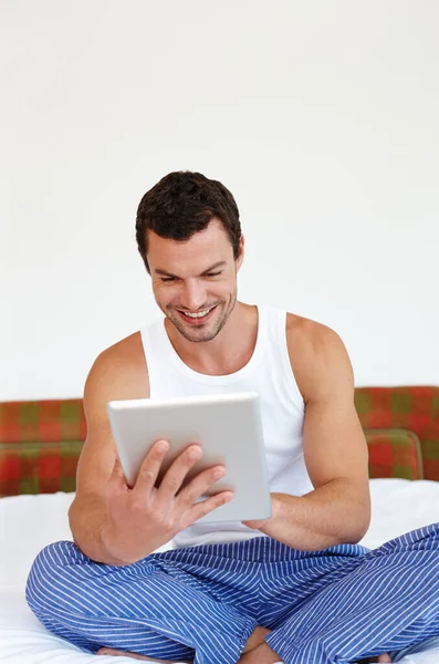 Enjoying Ease Touch Technology Man Sitting His Bed Holding Digital — Stock Photo, Image