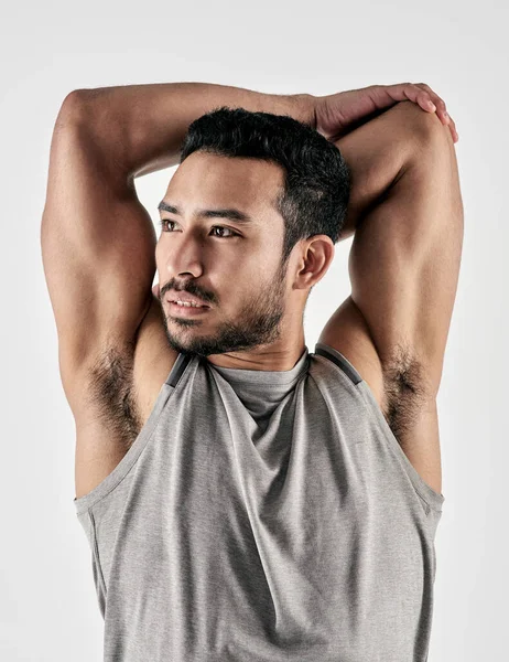 Sweat Sacrifice Builds Strength Studio Shot Muscular Young Man Stretching — Stock Photo, Image