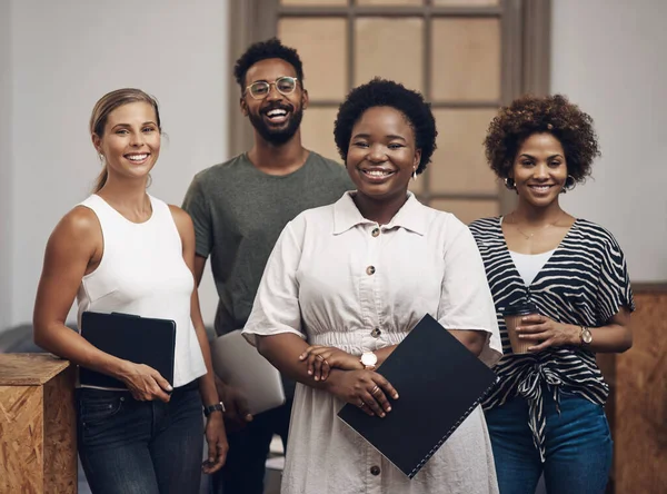 stock image Build your team, build your business. Portrait of a group of young businesspeople working together in a modern office