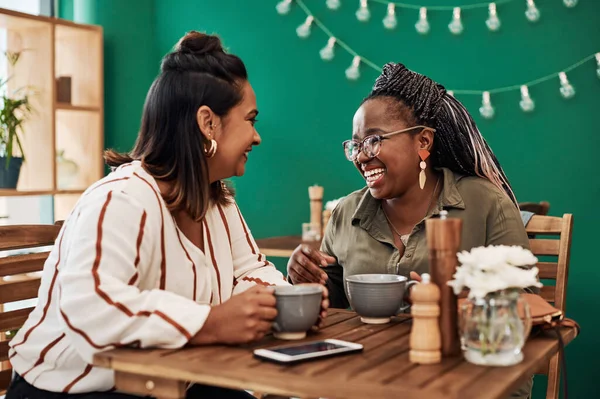 stock image Nobody makes you feel better than your best friend. two young women chatting at a cafe