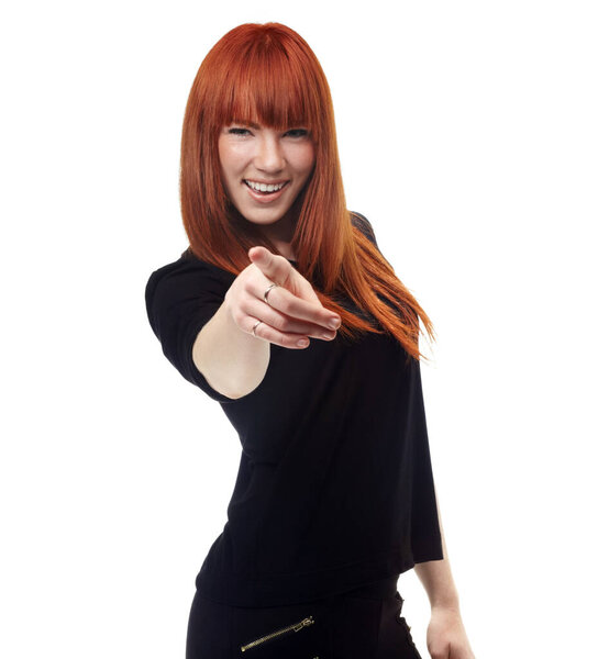 Portrait, choice and pointing with a ginger woman in studio isolated on a white background for motivation. Smile, accountability and hand gesture with a happy young female person making a decision.