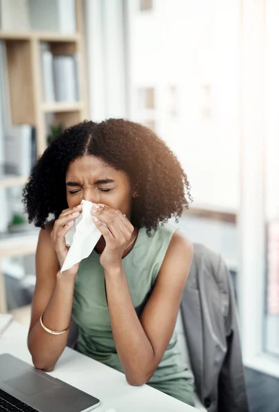 Allergies, blowing nose or sick woman in office or worker with hay fever sneezing or illness in workplace. Female sneeze or business person with toilet paper tissue, allergy virus or disease at desk.