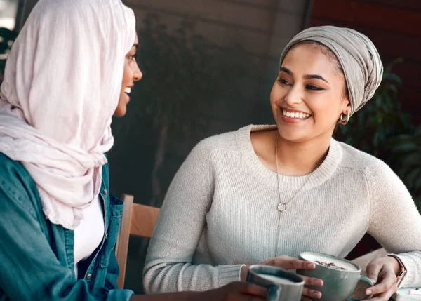 Friends, coffee shop and muslim with women in cafe for conversation, food and social. Happy, relax and culture with arabic female customer in restaurant for discussion, happiness and meeting.