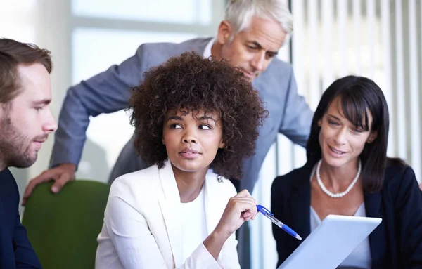 stock image Getting the job done with teamwork. a group of business colleagues meeting in the boardroom