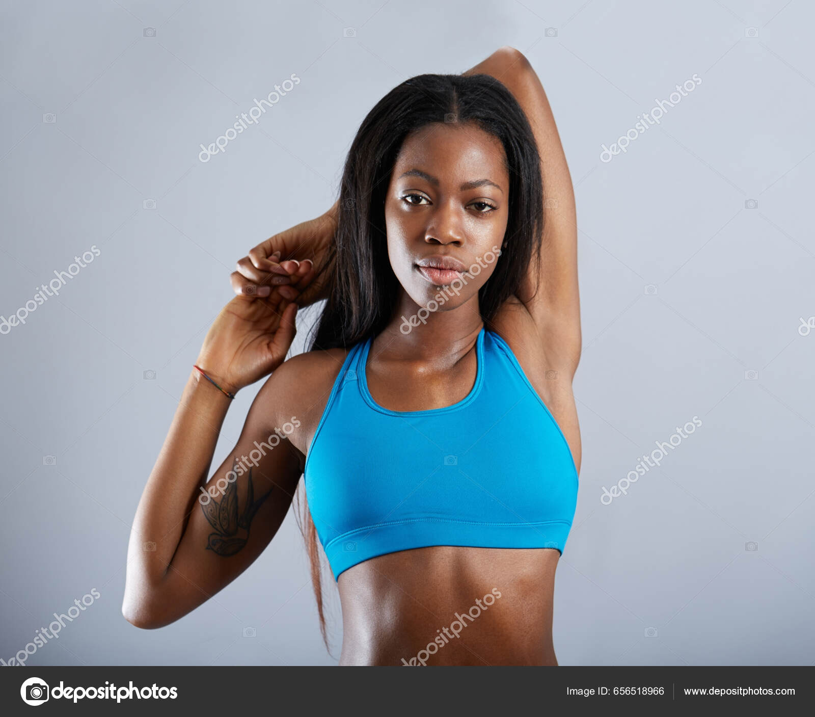Black Woman Studio Portrait Stretching Arms Fitness Exercise