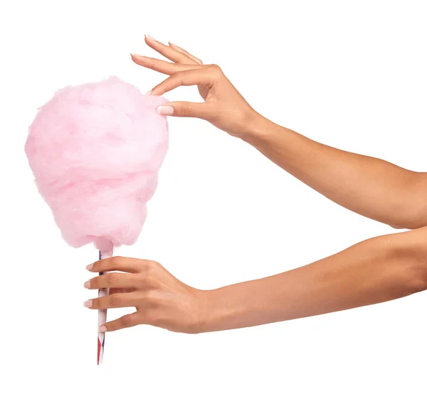 stock image Cotton candy, closeup and woman hands isolated on a white background for sweets, pink food and holiday treat. Person hand holding soft, color cone for youth party, childhood and festival in studio.