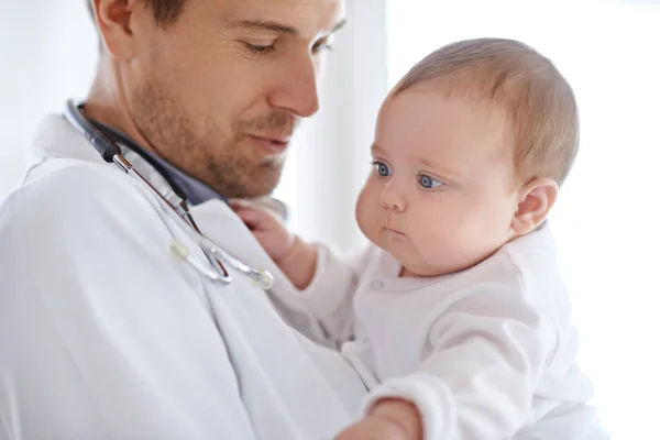 Doctor Pediatrician Holding Baby Healthcare Assessment Medical Support Growth Newborn Stock Picture