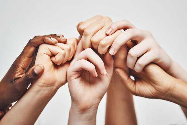 People, group diversity and holding hands isolated on a white background for solidarity, support and collaboration. Love, power and community of women and men hand or palm together for hope or care.