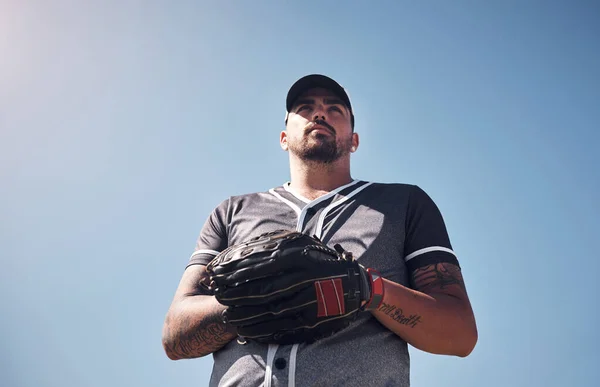 stock image Go big or go home. a confident young man playing a game of baseball