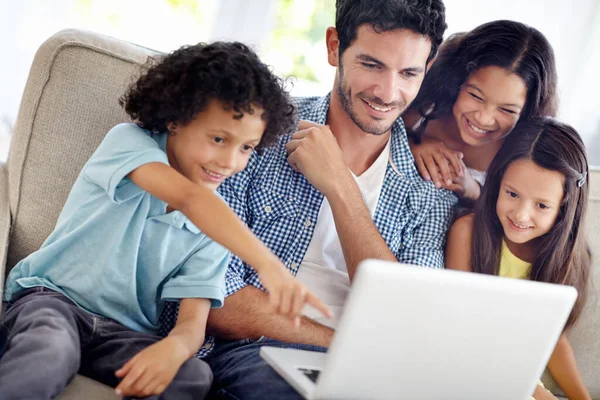 Laptop, watch and happy family father, children or people point at online shopping choice, social media video or meme. Happiness, love and group of kids with dad streaming movie in home living room.