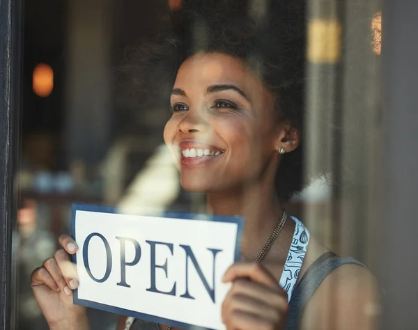 Open sign, restaurant store window and happy woman, small business owner or manager with cafe poster for welcome. Commerce billboard, startup coffee shop and female waitress for retail sales service.