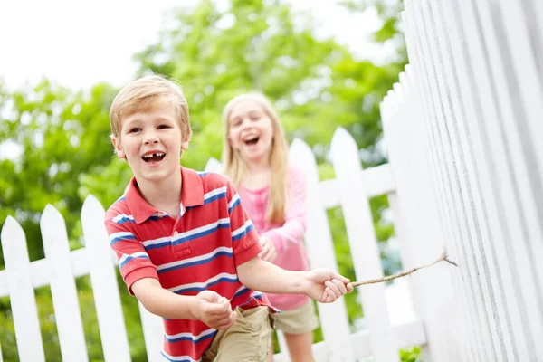 You Cant Catch Cute Young Boy Running Stick White Picket — Stock Photo, Image