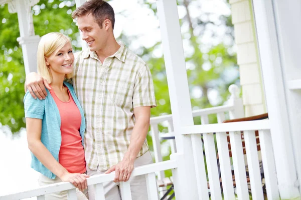 stock image I couldnt be happier. A happy young couple sharing some quality time together on the porch