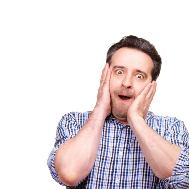 Confidence grows with age. A cropped portrait of a middle-aged man making a face, isolated on white