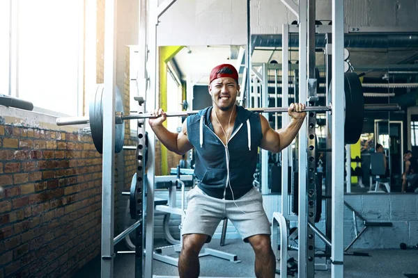 stock image Pain doesnt stop me, Im just getting started. a young man working out alone in the gym