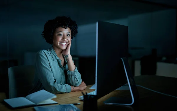 My goals are too important not to meet them. Portrait of a young businesswoman using a computer during a late night at work