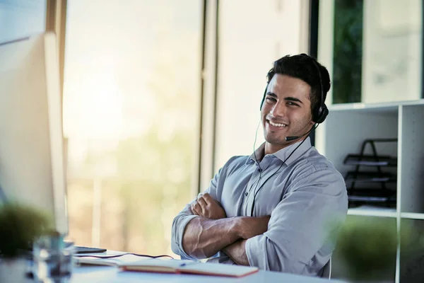 Help desk agent, smile and portrait of man with advice, confidence and happiness at at customer service agency. Happy phone call, conversation and callcenter consultant with headset in modern office