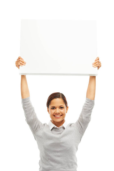 This idea is going to be awesome. Studio portrait of an attractive young woman holding a blank placard up in the air isolated on white