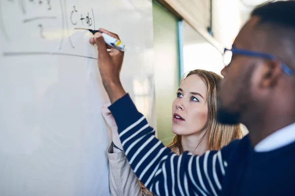 Understand Better Explains Young Woman Looking Young Man Writes Whiteboard — Stock Photo, Image