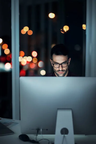 stock image Night, computer and serious business man in office for internet code, coding or software development. Technology, cloud computing and cyber security with male programmer for app, developer and it.